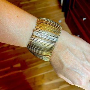 Gold plated bracelet with studs.